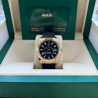 Rolex Sky-Dweller 326238 with a black baton dial and yellow gold case